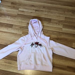 A pink Hollister hoodie